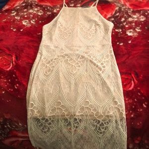 Very pretty dress lace and skin tone never worn